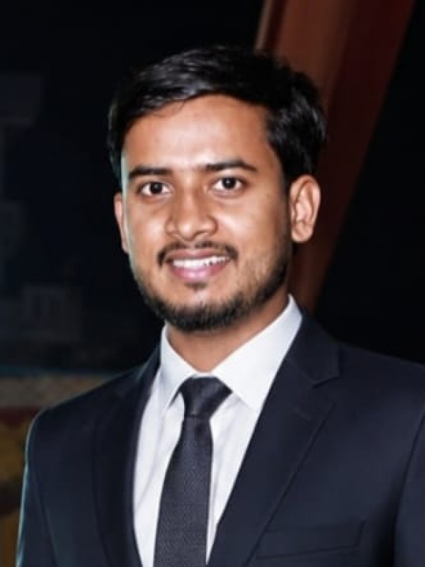 Sonu K Giri, general manager at Sai Ram Developers, photographed in a dark suit.